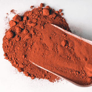 Powdered paint pigment in a shovel showing a key ingredient in paint.